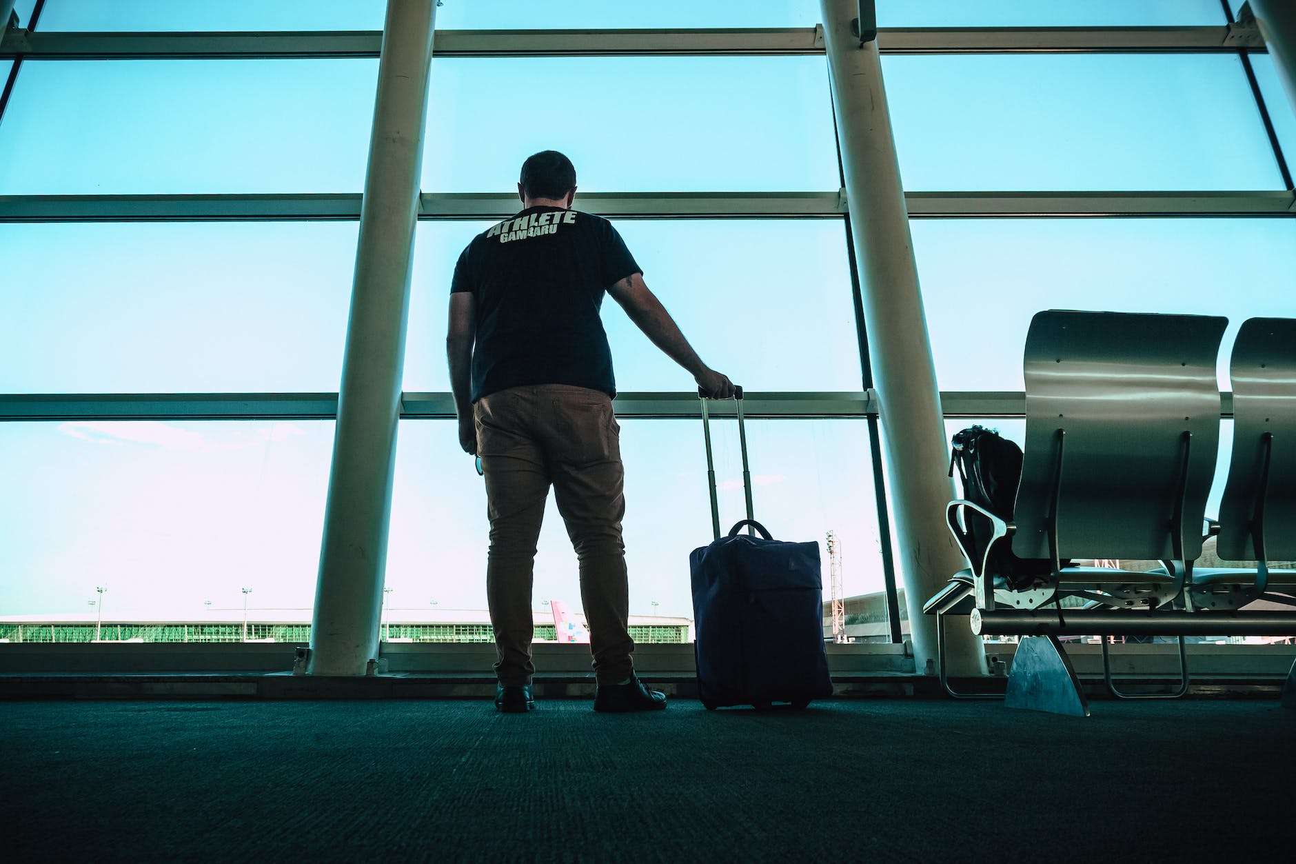 man holding luggage bag