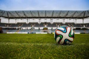 soccer ball on grass field during daytime