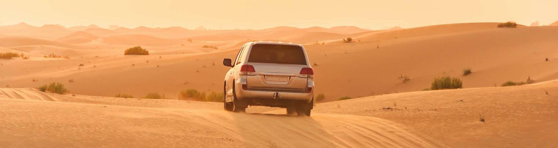 white suv on desert